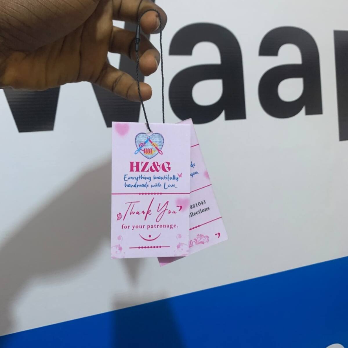 Custom shaped clothing tags with rope printed by Waaprint