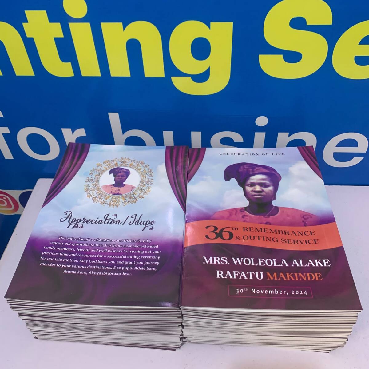 Inside pages and stack of event programmes printed by Waaprint