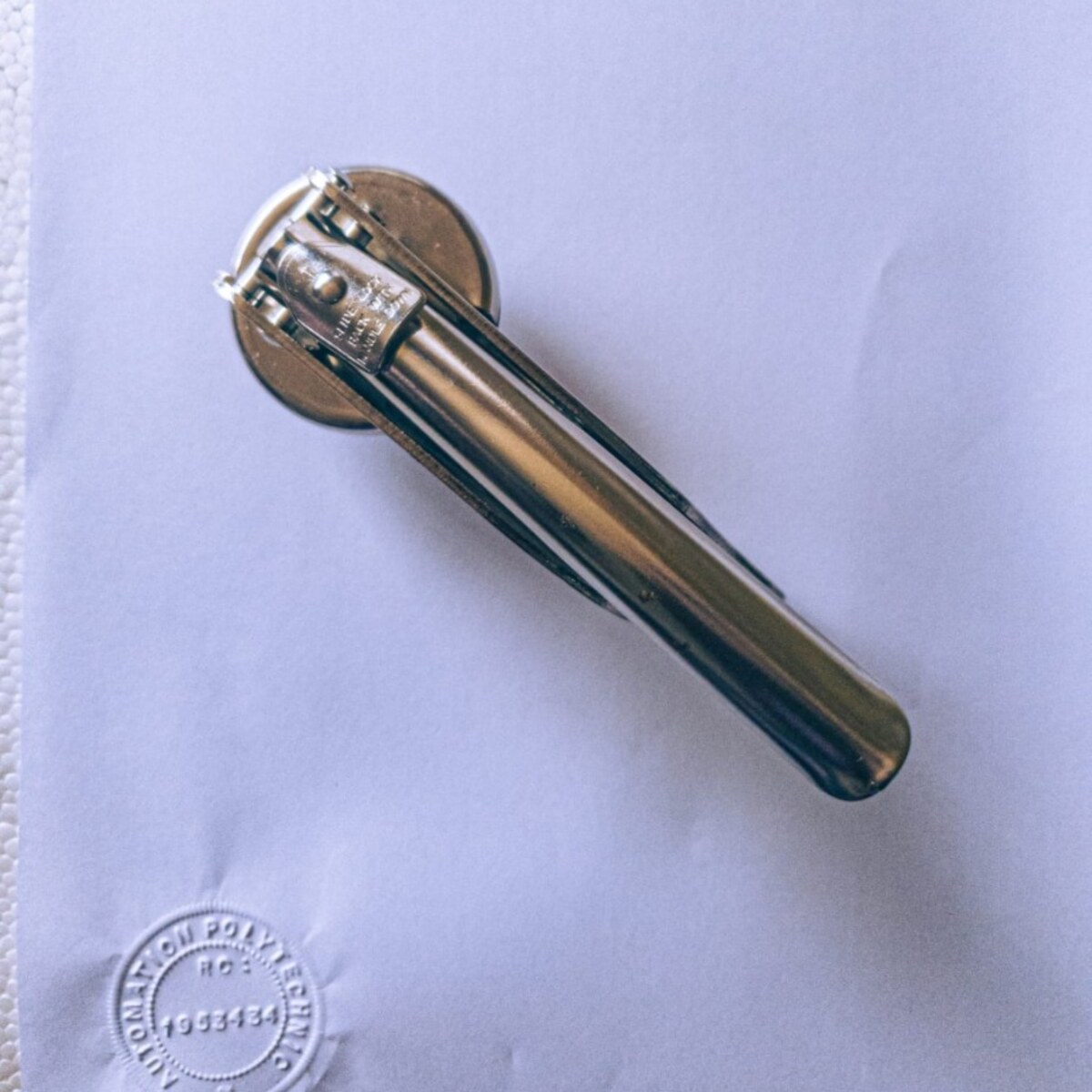 Custom embossed circular seal impression on paper